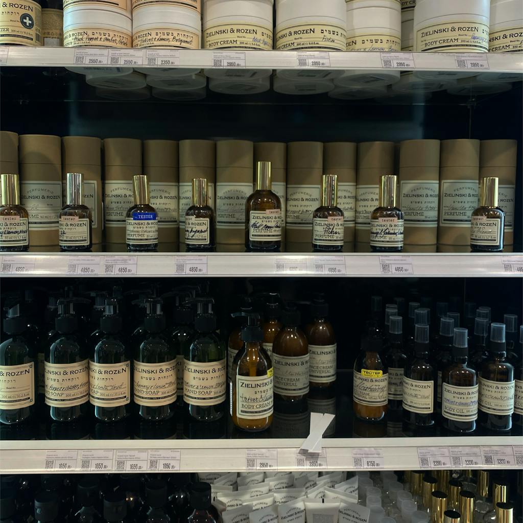 Variety of beauty products displayed on store shelves, perfect for skincare and aromatherapy enthusiasts.